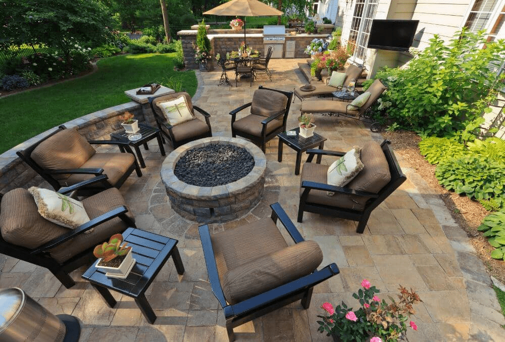 outdoor concrete patio with fireplace